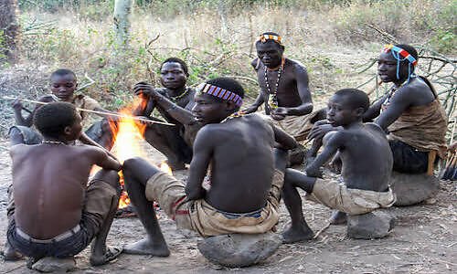 Hadzabe community gathered around a fire