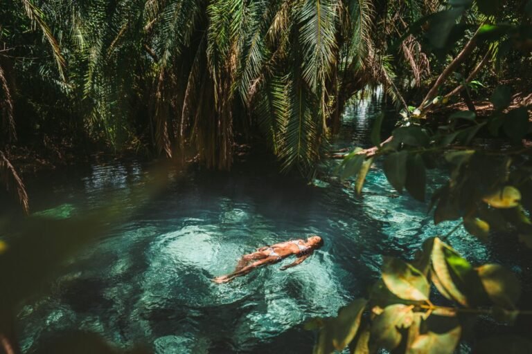 Swimmer floating in the clear water of Kikuletwa (Chemka) hot springs